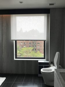 Roller shades in a bathroom